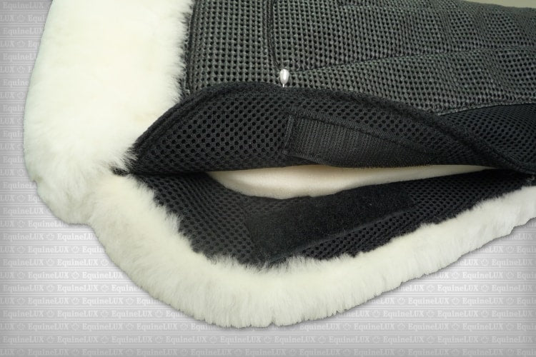 EquineLux ComfortLUX™ dressage half pad with sheepskin lining, pommel roll, and pockets for shims