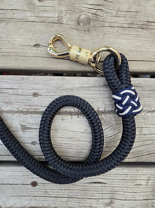 5/8" 14ft black lead rope with gold panic snap, tassel end, navy and cream paracord accents