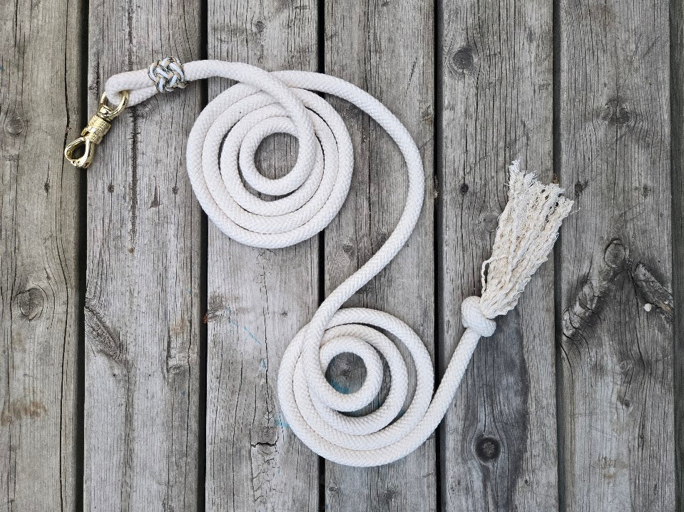 5/8" 11ft cream cotton lead rope with brass panic snap and tassel end