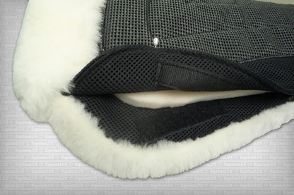 EquineLux ComfortLUX™ dressage half pad with sheepskin lining, pommel roll, and pockets for shims